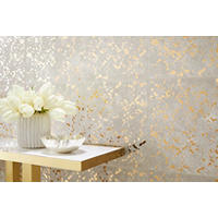 Thumbnail image of The Annie Selke Goldleaf Speckle tile features metallic, mirrored gold splatters on top of a cowhide-look texture peeking out from behind. Truly a designer piece, the 13" x 23" Goldleaf ceramic wall tile commands attention
