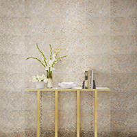 Thumbnail image of Goldleaf Speckle tile features metallic, mirrored gold splatters on top of a cowhide-look texture peeking out from behind. Truly a designer piece, the 13" x 23Goldleaf ceramic wall tile commands attention behind this small entry table with flowers and books upon it.