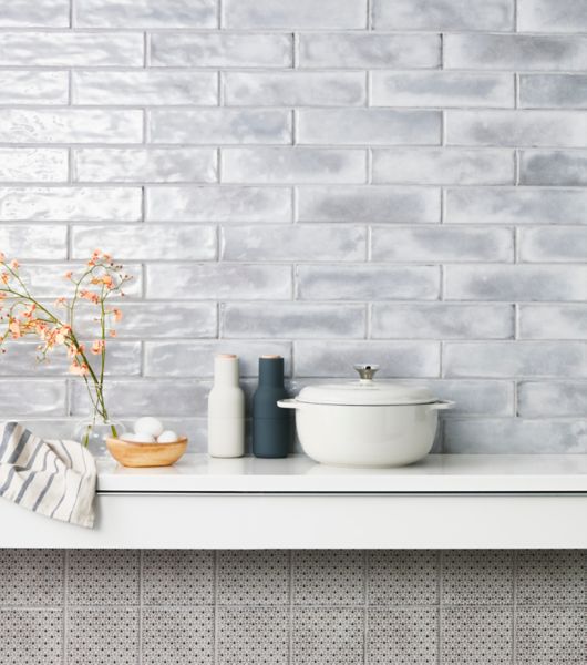 Grey glossy subway tile kitchen