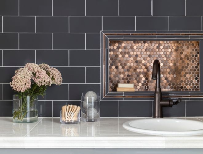 Laundry room backsplash with blue subway tile and metallic copper penny round mosaic.