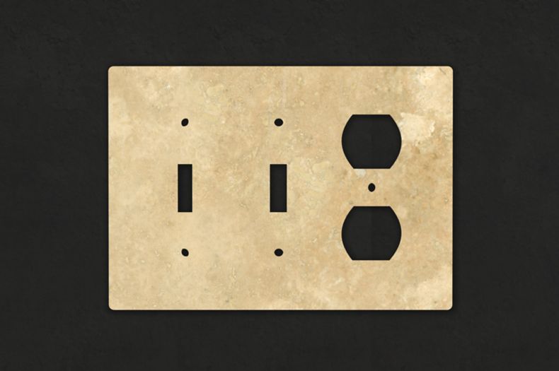 Beige natural stone switchplate for lights and outlets.