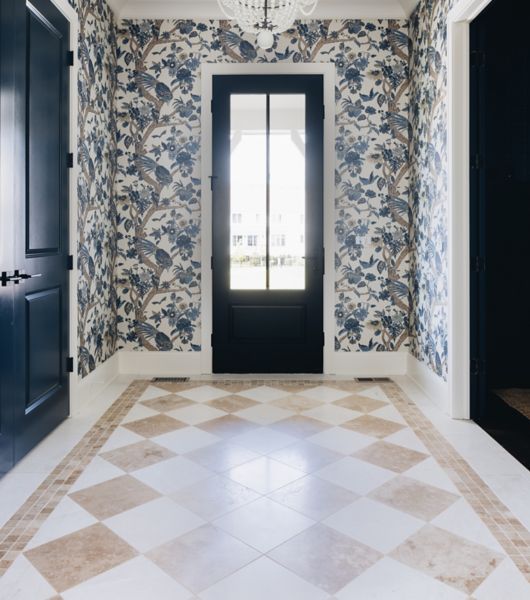 Entryway with checkerboard floor featuring white brushed marble and tan honed travertine tiles.