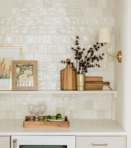 The wall of this butler's pantry features white square handmade-look tile in durable ceramic with a glossy finish