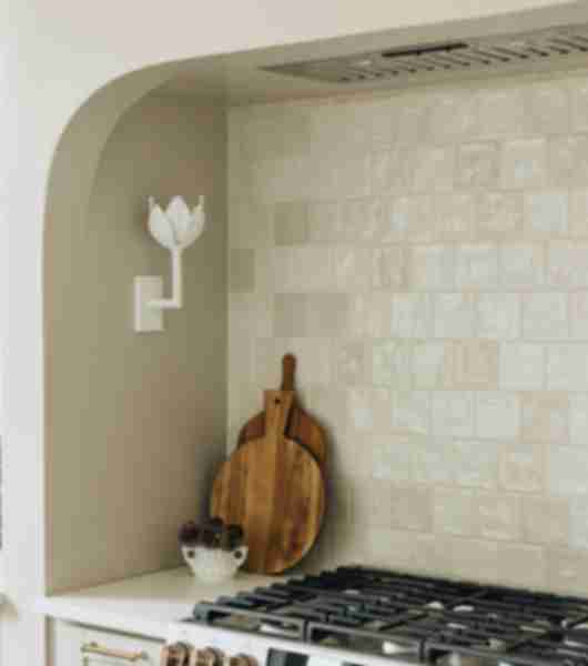 White tile kitchen backsplash with stove top