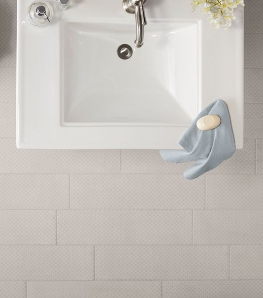 Patterned tile on bathroom floor.