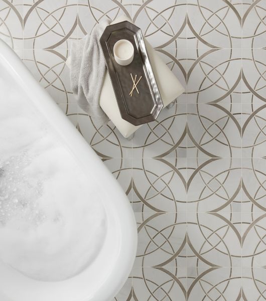 polished marble mosaic on bathroom floor in with tub and bath tray