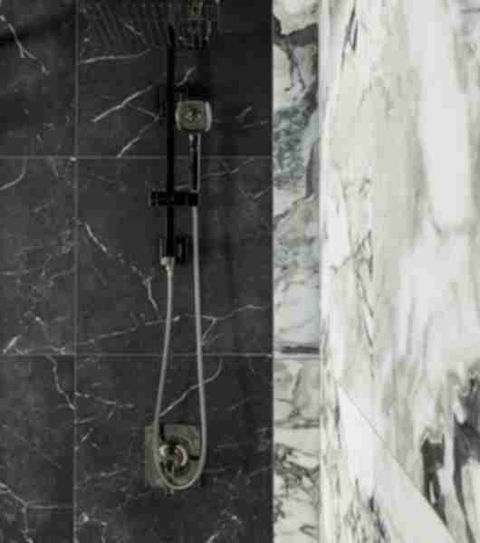 This large shower features black and white marble-look tile.