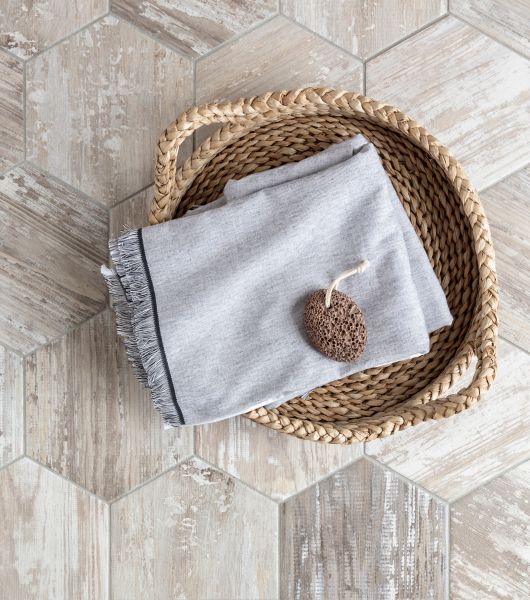 Laundry room with brown wood-look hexagon floor tile