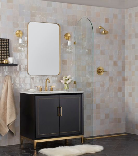 Bathroom shower and sink vanity with wall tiled in cream-colored tile