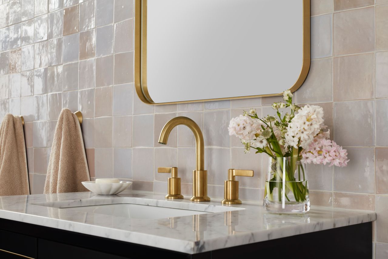 This bathroom features cream-colored handmade Zellige wall tile.
