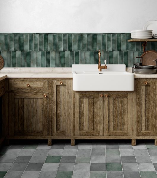 Farmhouse-style kitchen with lush green tile backsplash.