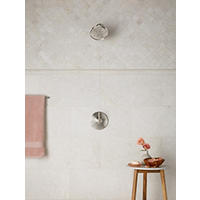 Thumbnail image of Ivory marble wall tile and arabesque tile in bathroom shower. 