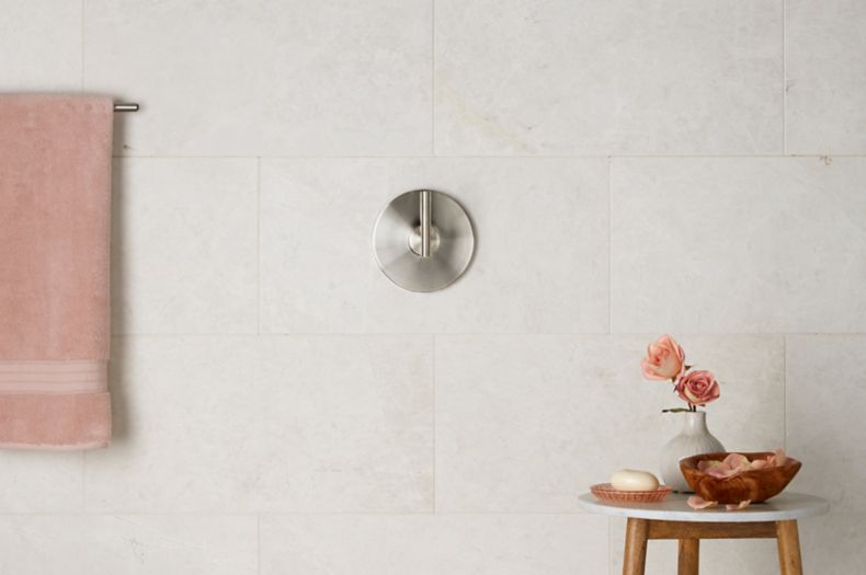 Shower wall with ivory marble wall tile arabesque tile. 