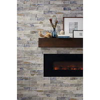 Thumbnail image of Fireplace surround with the rustic look of weathered wood in a ceramic subway tile set in a horizontal brick pattern. Mantal is a large floating pice of warner toned wood and fire box is matte black.  