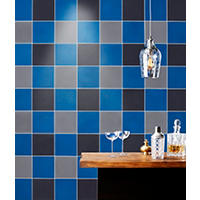 Thumbnail image of Feature wall behind bar area with 8" square tiles stacked in three colors, blue, black and grey.