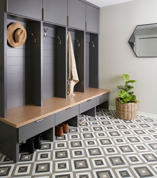 Mudroom featuring floor covered with diamond-pattern marble mosaic tile in shades of white, black and gray