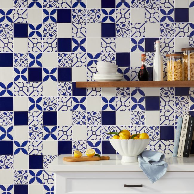 Blue and white kitchen with patterned tile.