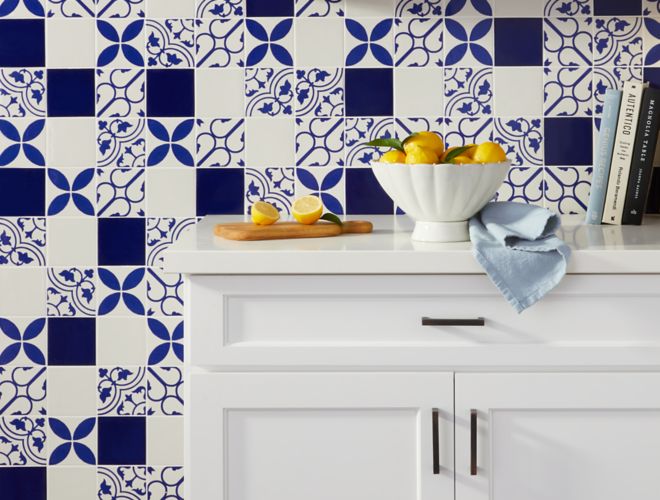 Mediterranean kitchen with blue and white patterned wall tile.