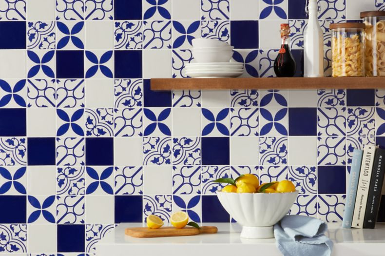 Mediterranean kitchen with blue and white patterned wall tile.