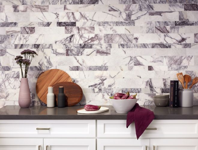 White marble with purple veining in kitchen backsplash.