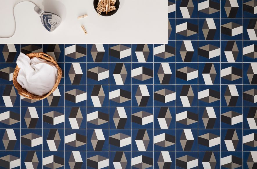 Blue patterned laundry room tiles.