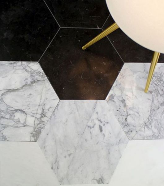 White, grey, and black stone hexagon floor tile.