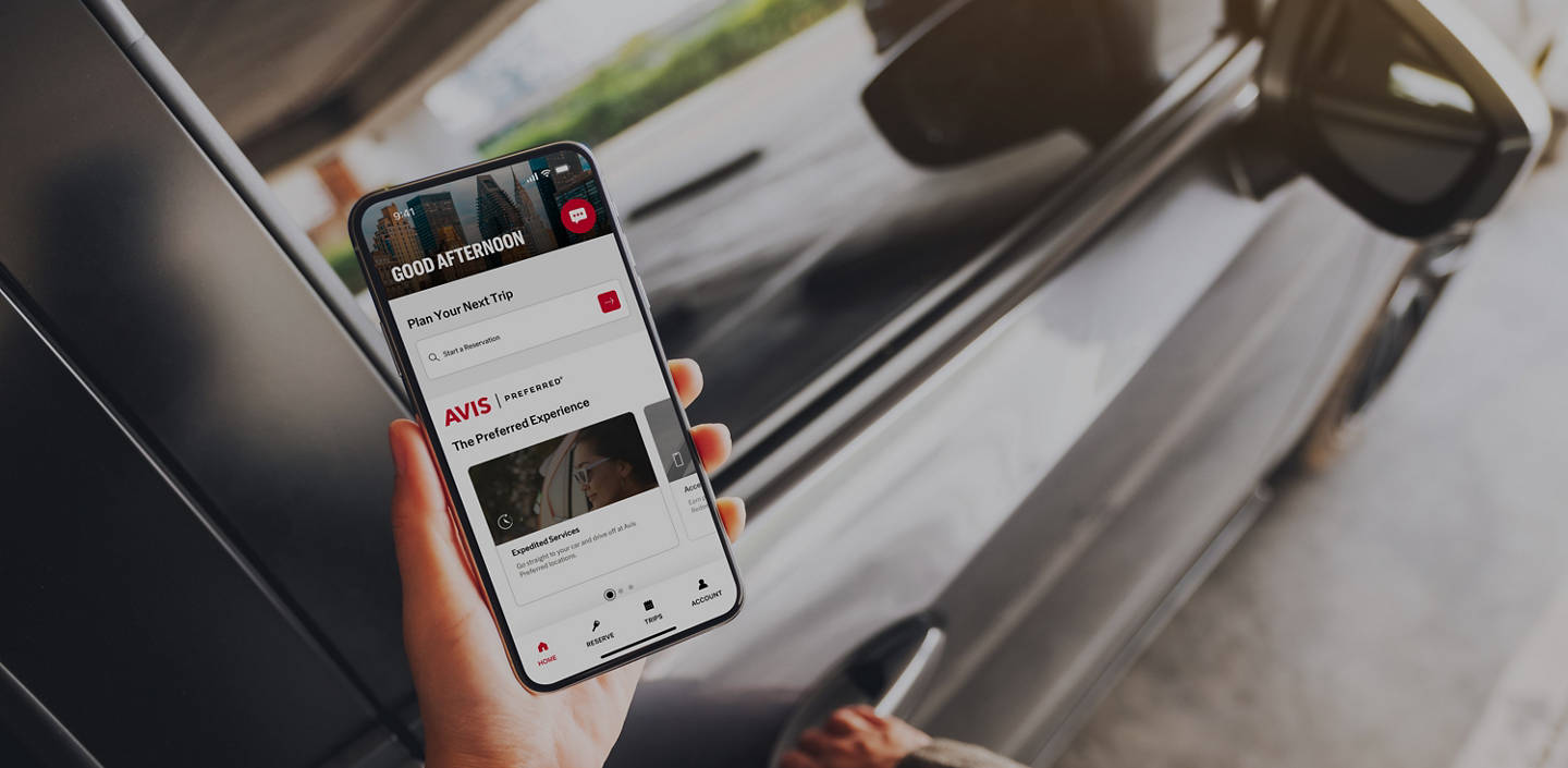 Mockup image of a woman holding and using mobile phone with blank screen while opening the car door