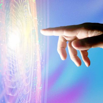 A hand touching a screen of light