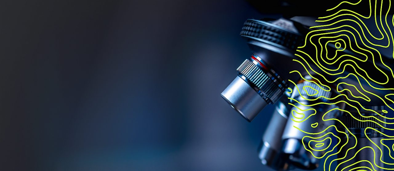Close up of microscope in laboratory setting with overlaid green abstract pattern on dark background 