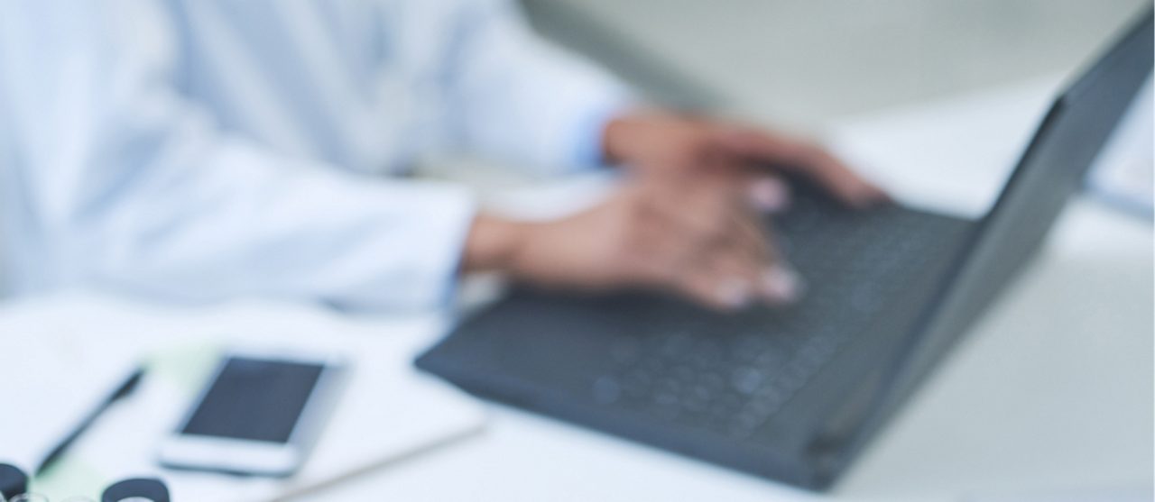  Individual typing on a computer