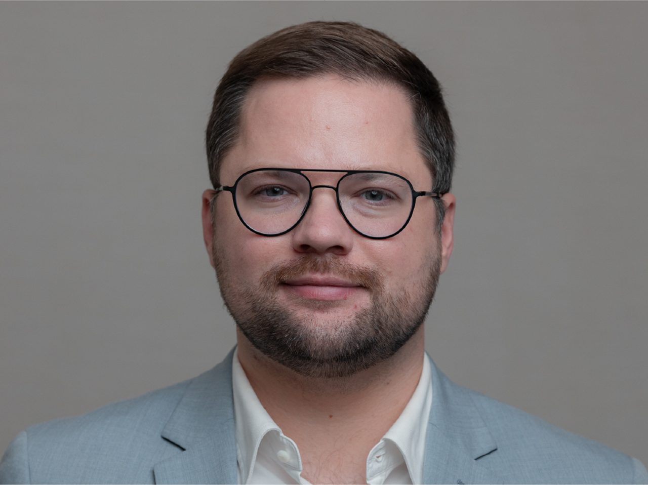 A portrait image of Alex Filicevas, Executive Director, World Bladder Cancer Patient Coalition.