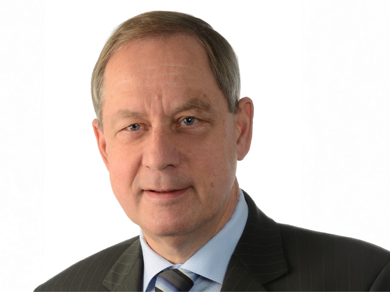 A portrait image of André Deschamps, former Chairman, Europa Uomo.