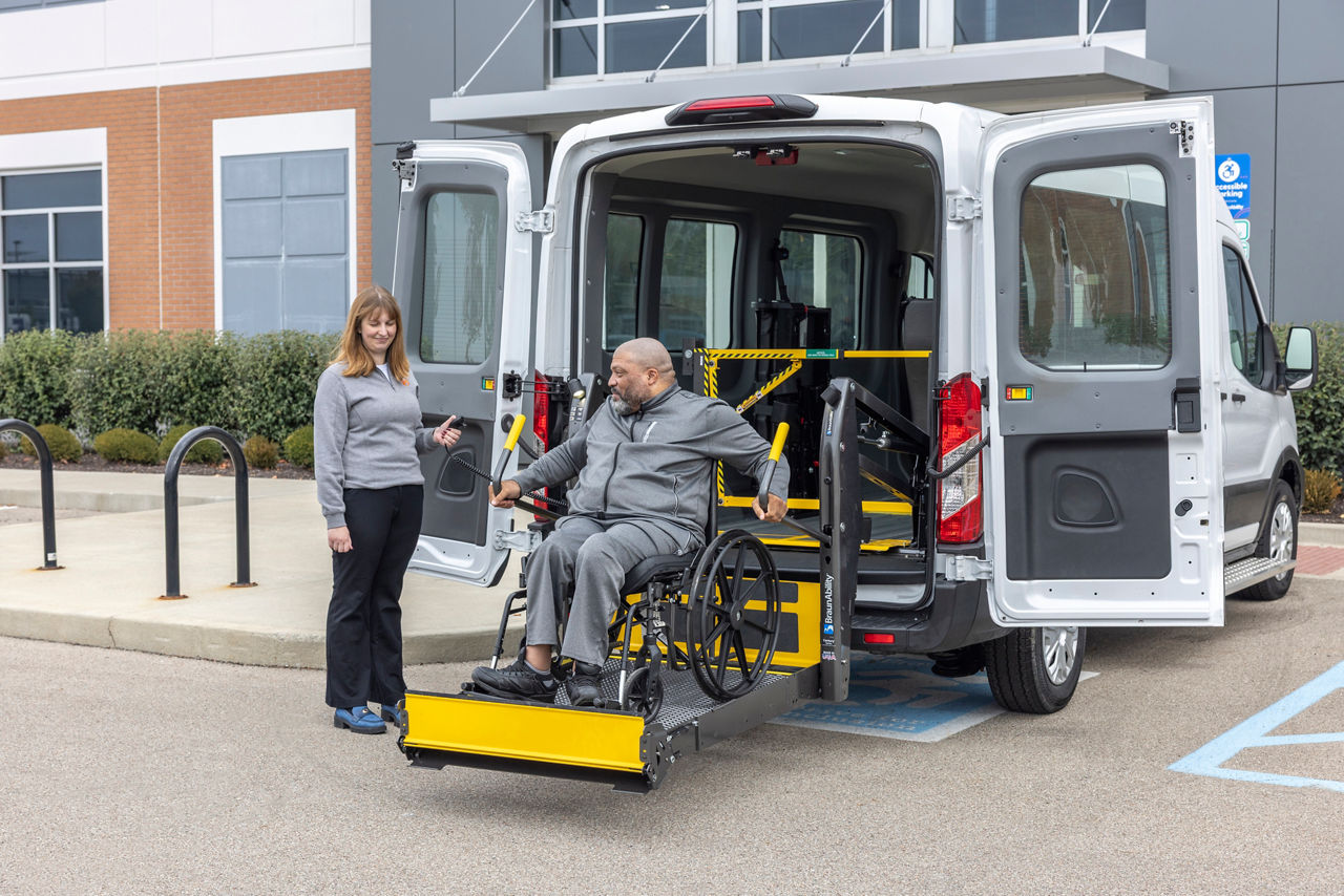 LiftSentinel in use in full-size vehicle and wheelchair user on lift.