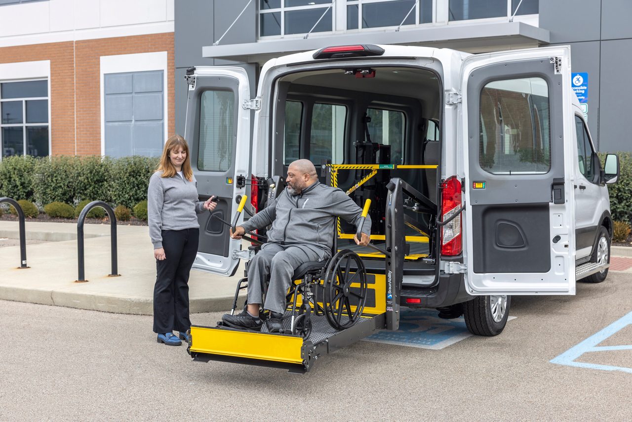 LiftSentinel in use in full-size vehicle and wheelchair user on lift.