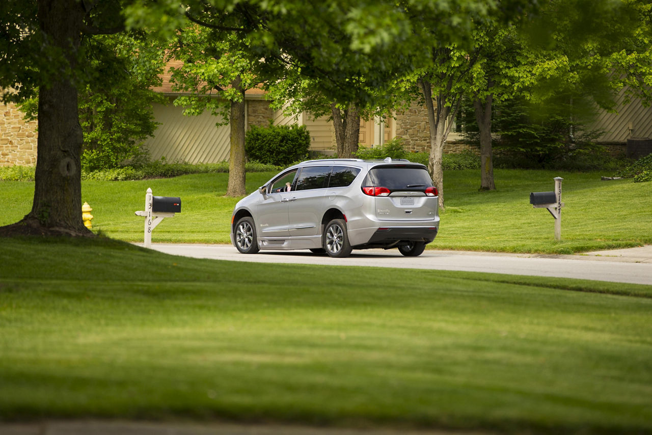 Chrysler Pacifica wheelchair van driving down a road