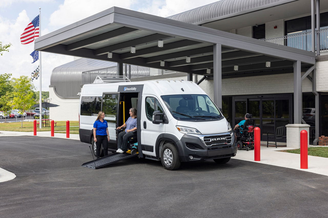 BraunAbility employee and wheelchair user with ProMaster Simple Stow van