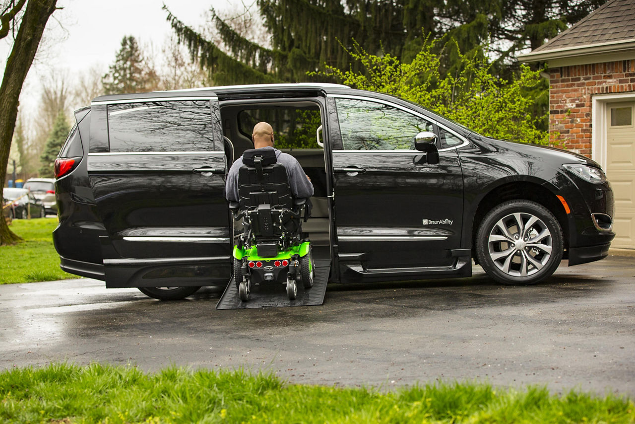 Man using infloor ramp on the Chrysler Pacifica at his house 