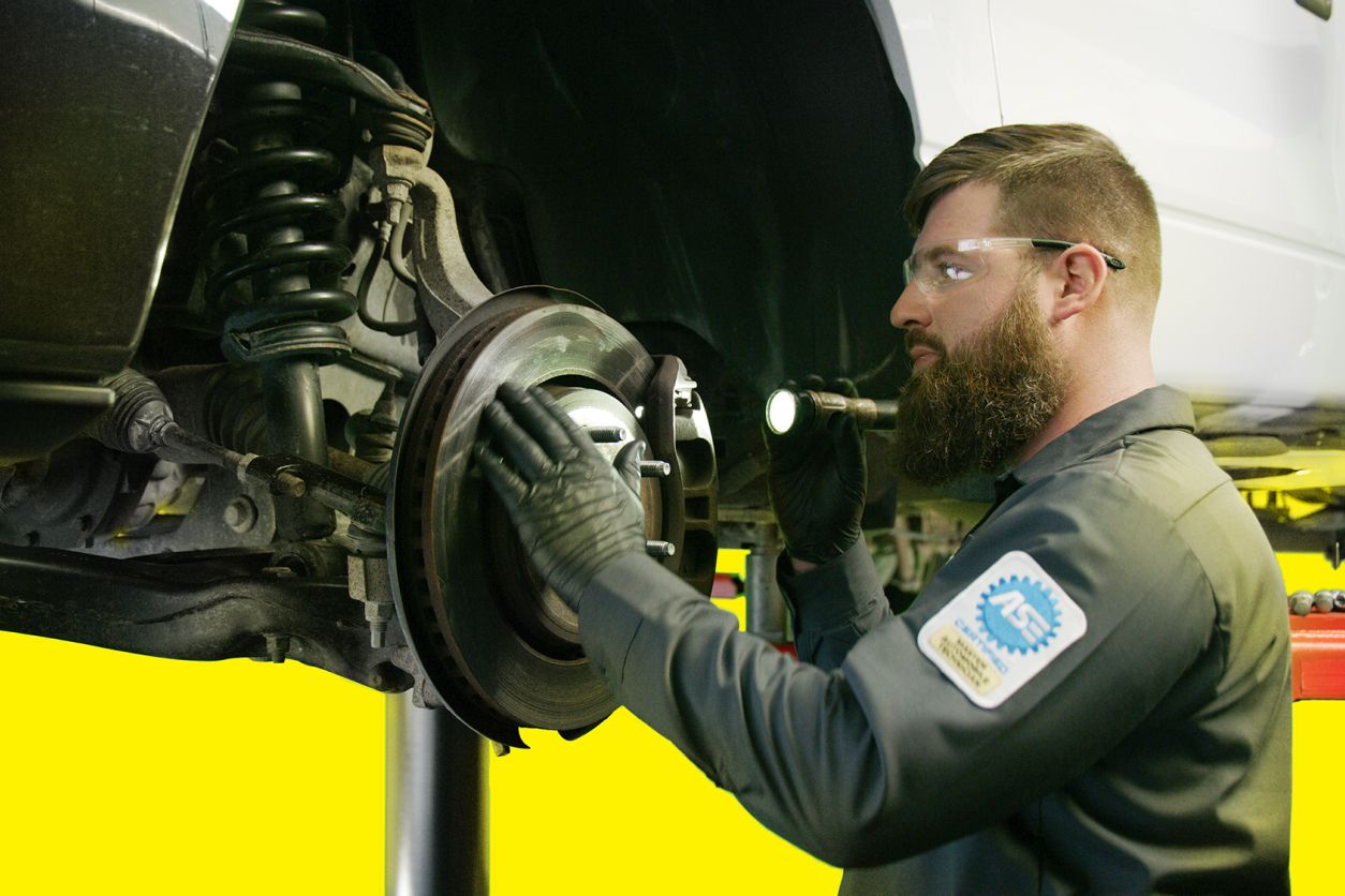 Mechanic checking air brakes