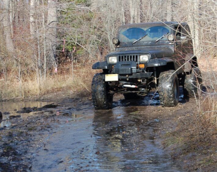 4wd truck offroading in mud