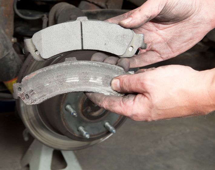 comparison of new and worn brake pads