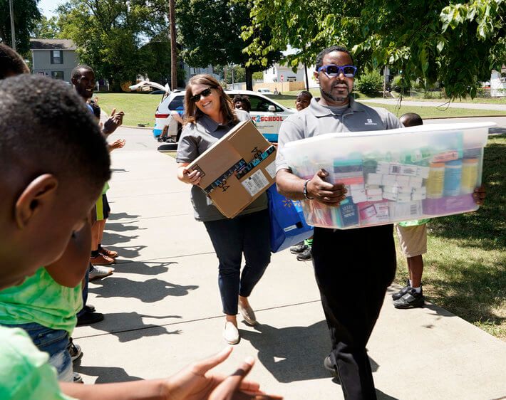 bridgestone team members delivering school supplies