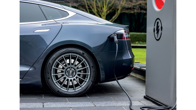 A car charging at an EV charging station.