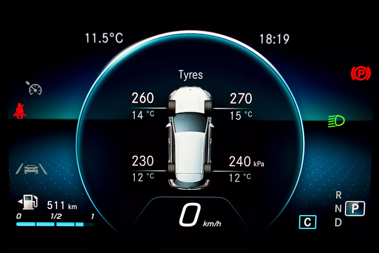 Digital car dashboard display showing tire pressure and temperature for each tire. Left front  tire is 260 kPa and 14 Celsius. Left back tire is 230 kPa and 12 Celsius. Right front tire is 270 kPa and 15 Celsius. Right back tire is 240 kPa and 12 Celsius.