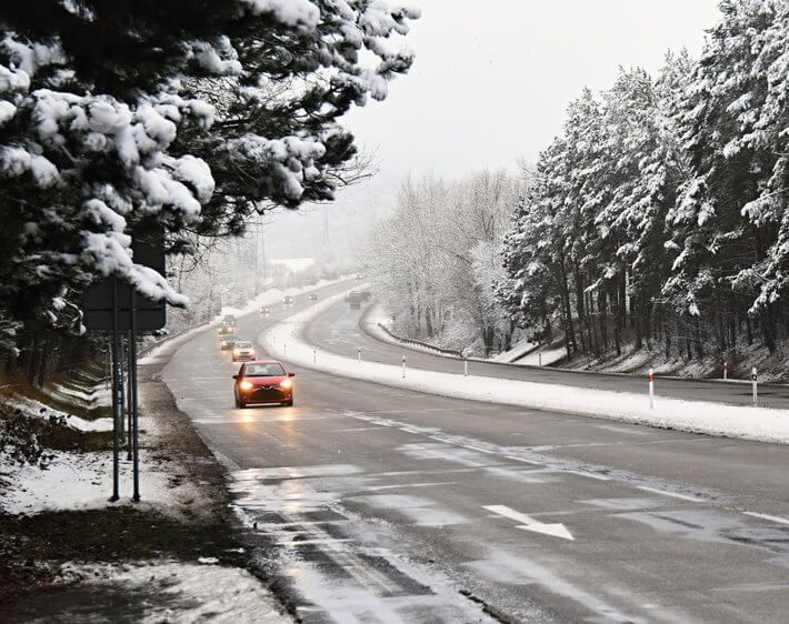 cars driving in the snow