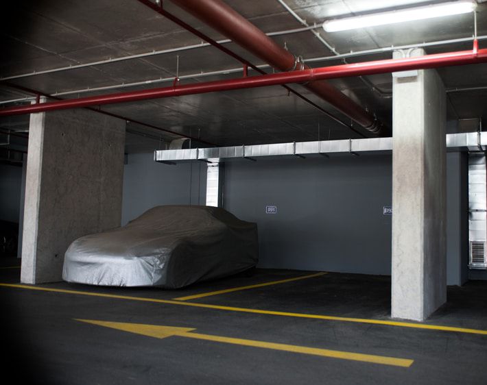 Car covered in a garage