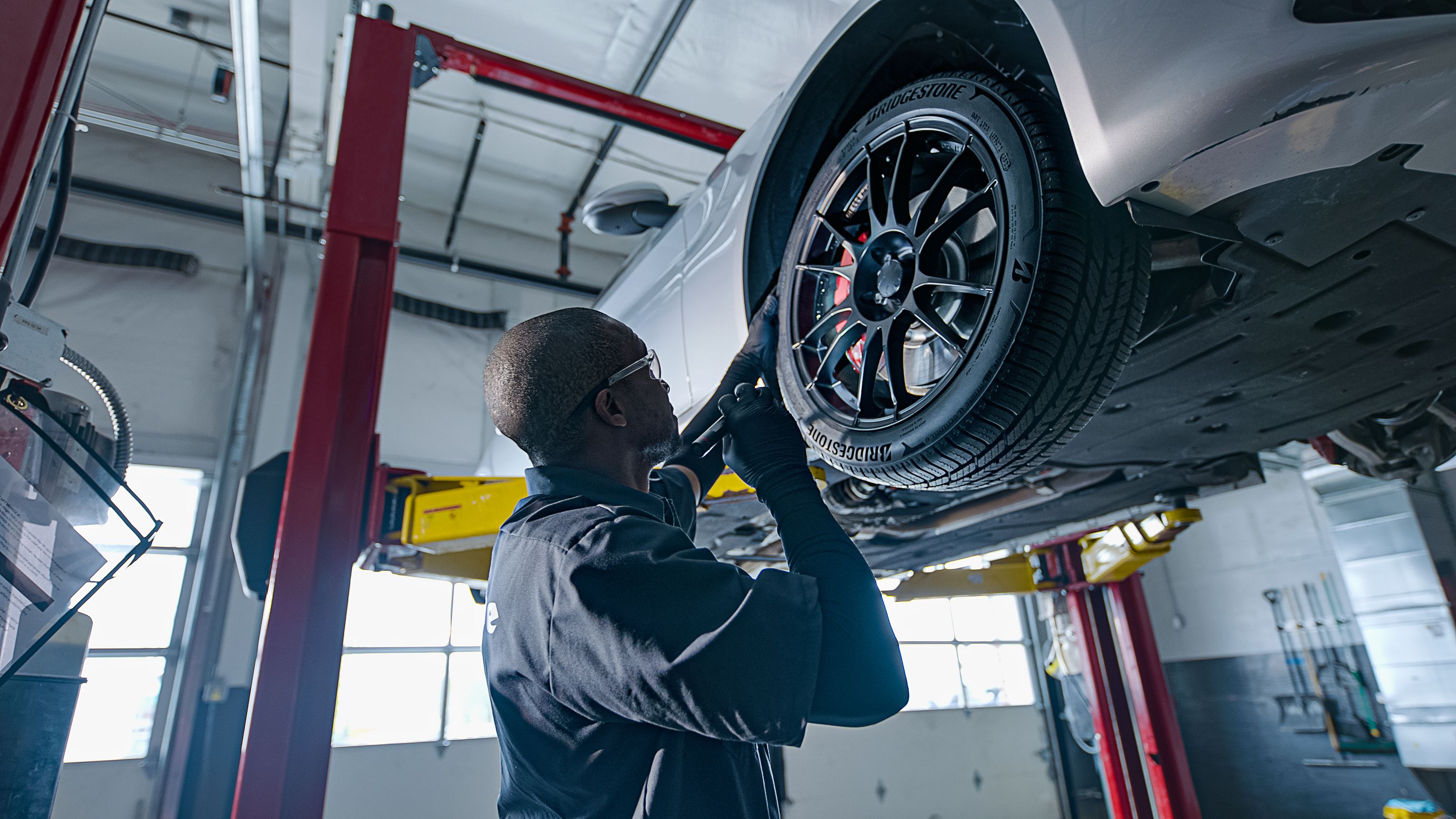 Mechanic working on car tires