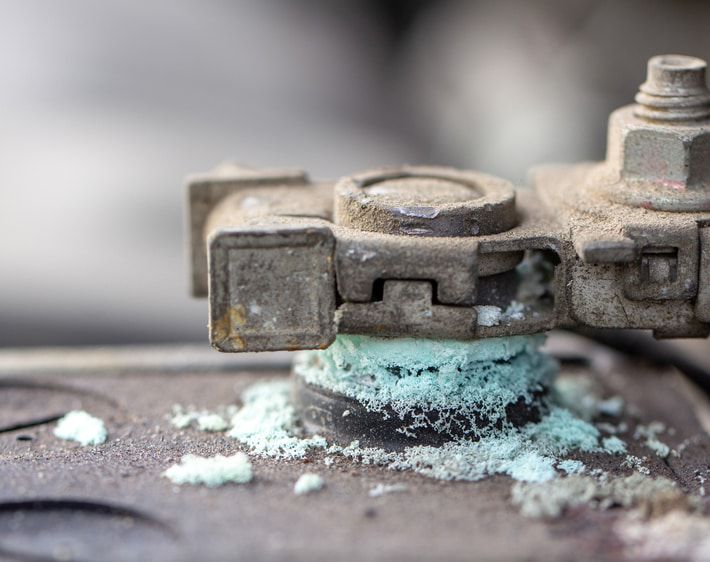 Close up of a corroded battery terminal