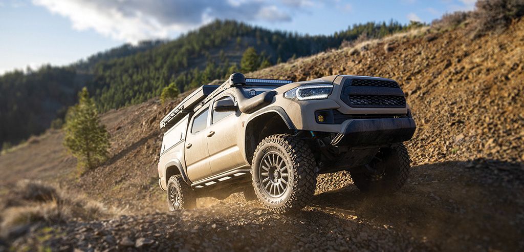 offroad truck on gravel road with destination mt2 tire