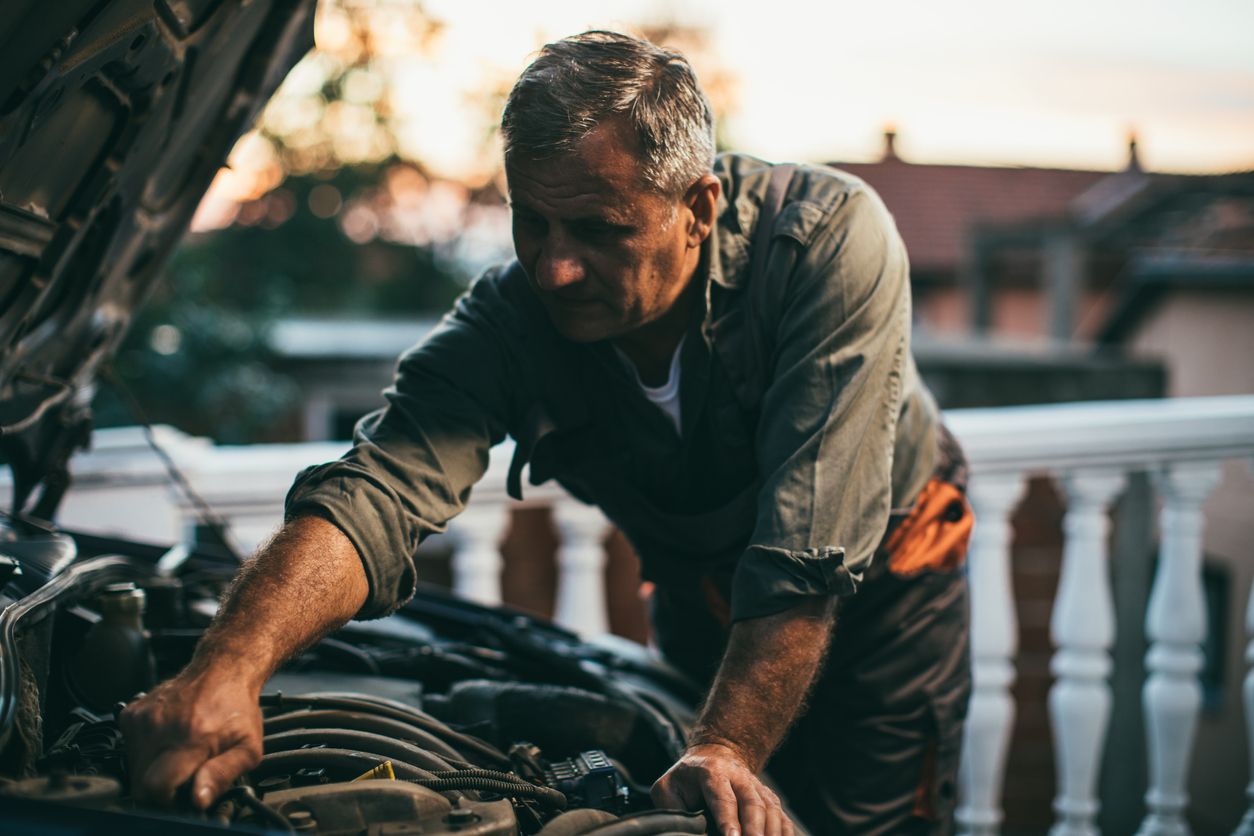 image of DIY mechanic servicing a car