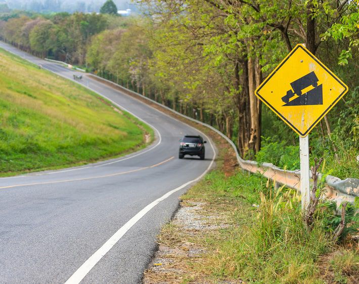 Driving down a steep slope